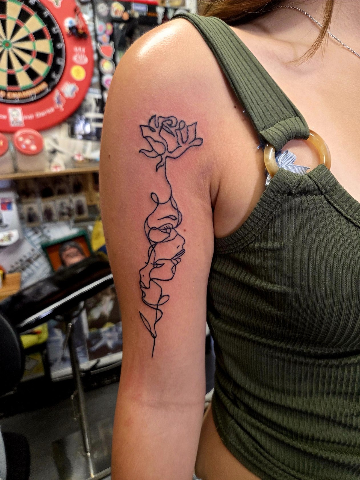 Delicate rose linework tattoo