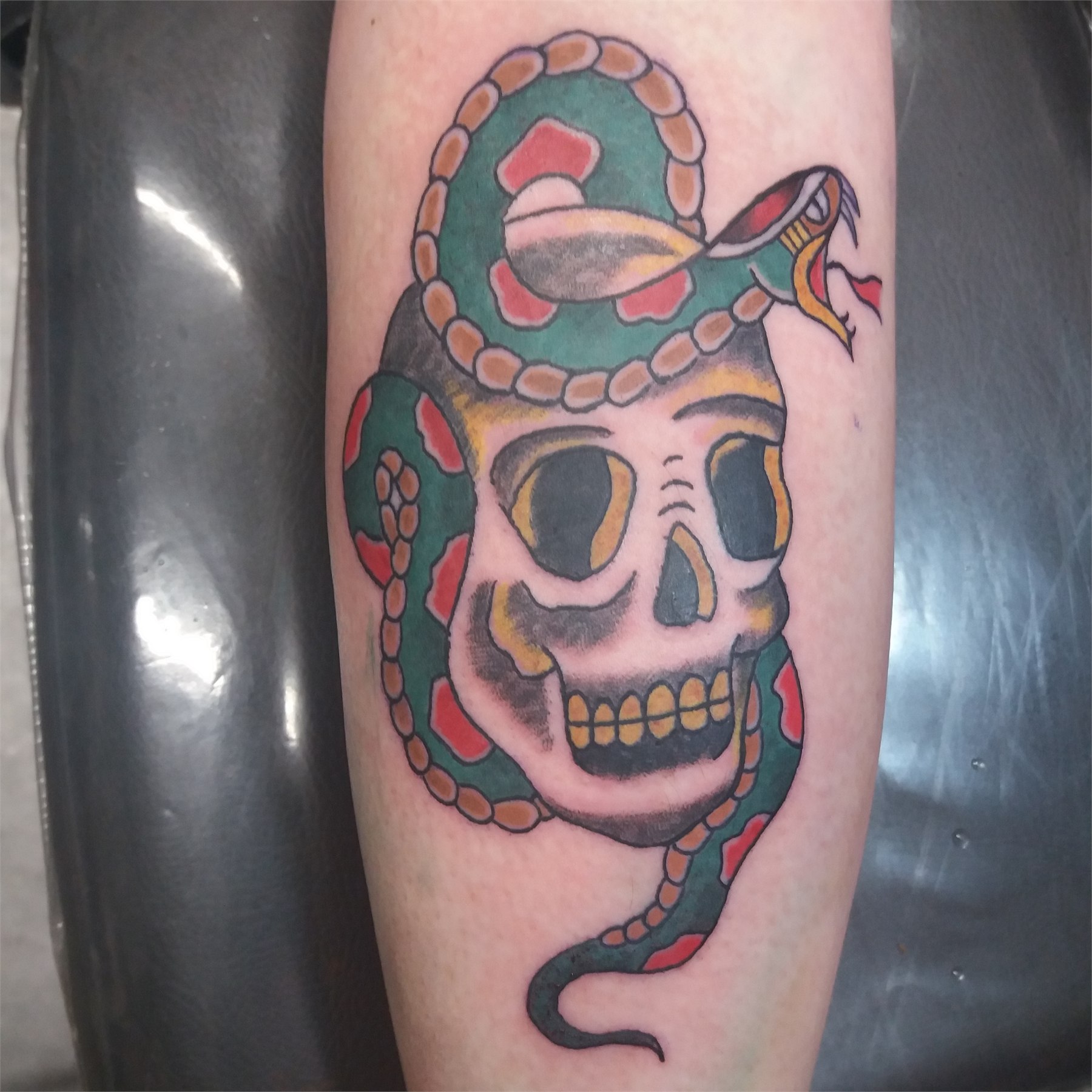 Colour skull and snake tattoo